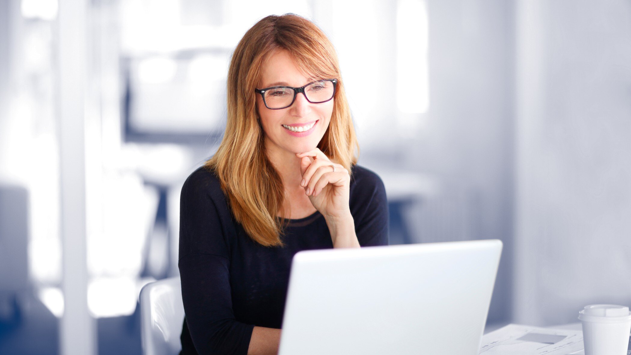 Woman staring at laptop