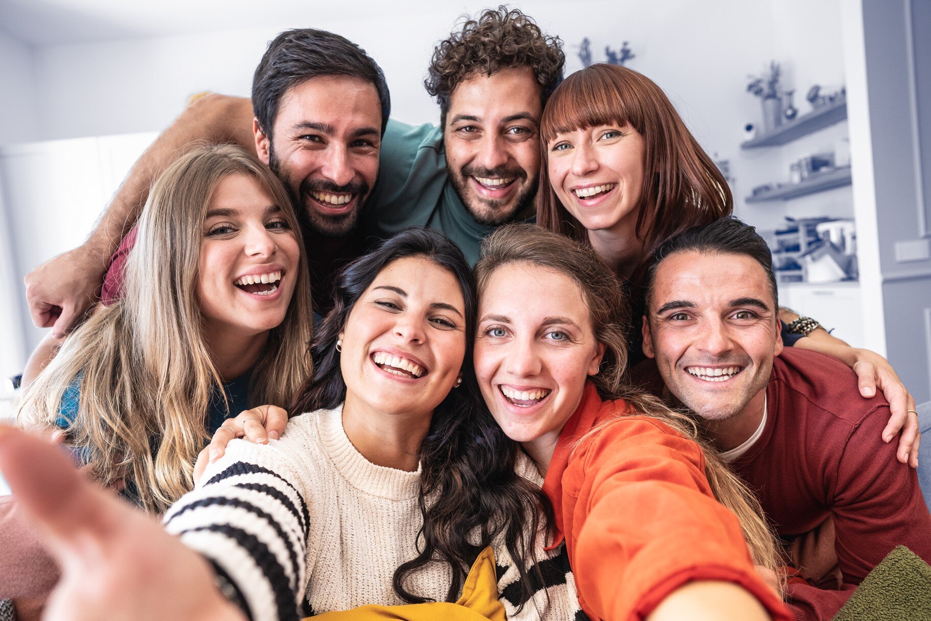 A group of Gen Z and Gen Alpha friends taking a lively selfie together, showcasing their unique style and capturing the essence of their generation's digital-first communication and interaction. HatchEcom.