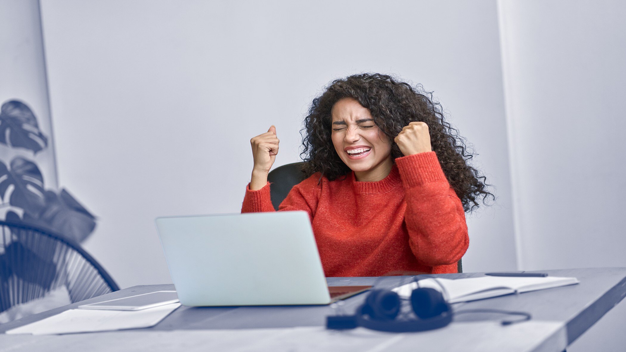 Happy Woman celebrating effective Ways to Retain Ecommerce Customers by HatchEcom