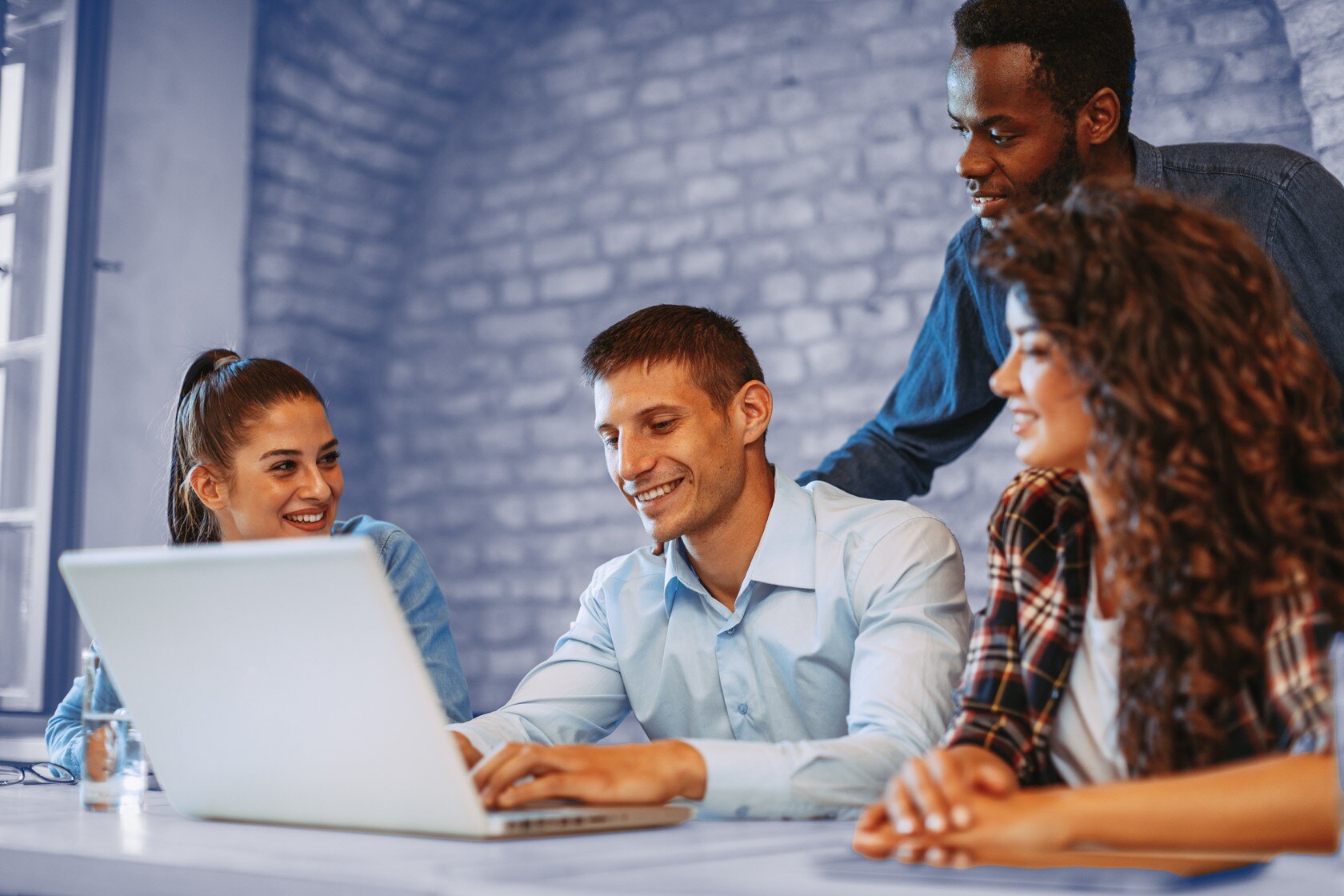 A group of team members engaged in a lively discussion about the future of cookie-based marketing. 